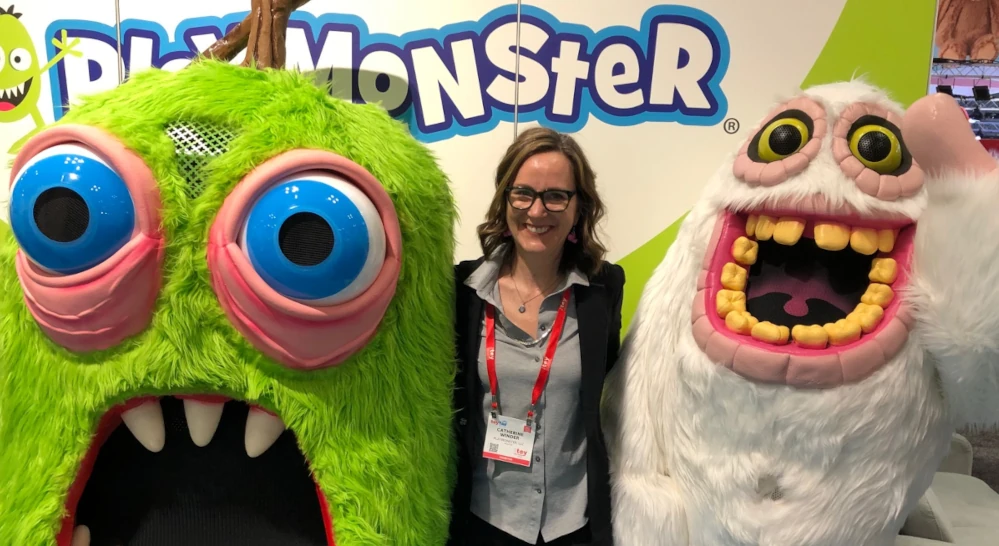 CATHERINE WINDER WITH THE "MY SIINGING MONSTERS" CHARACTERS