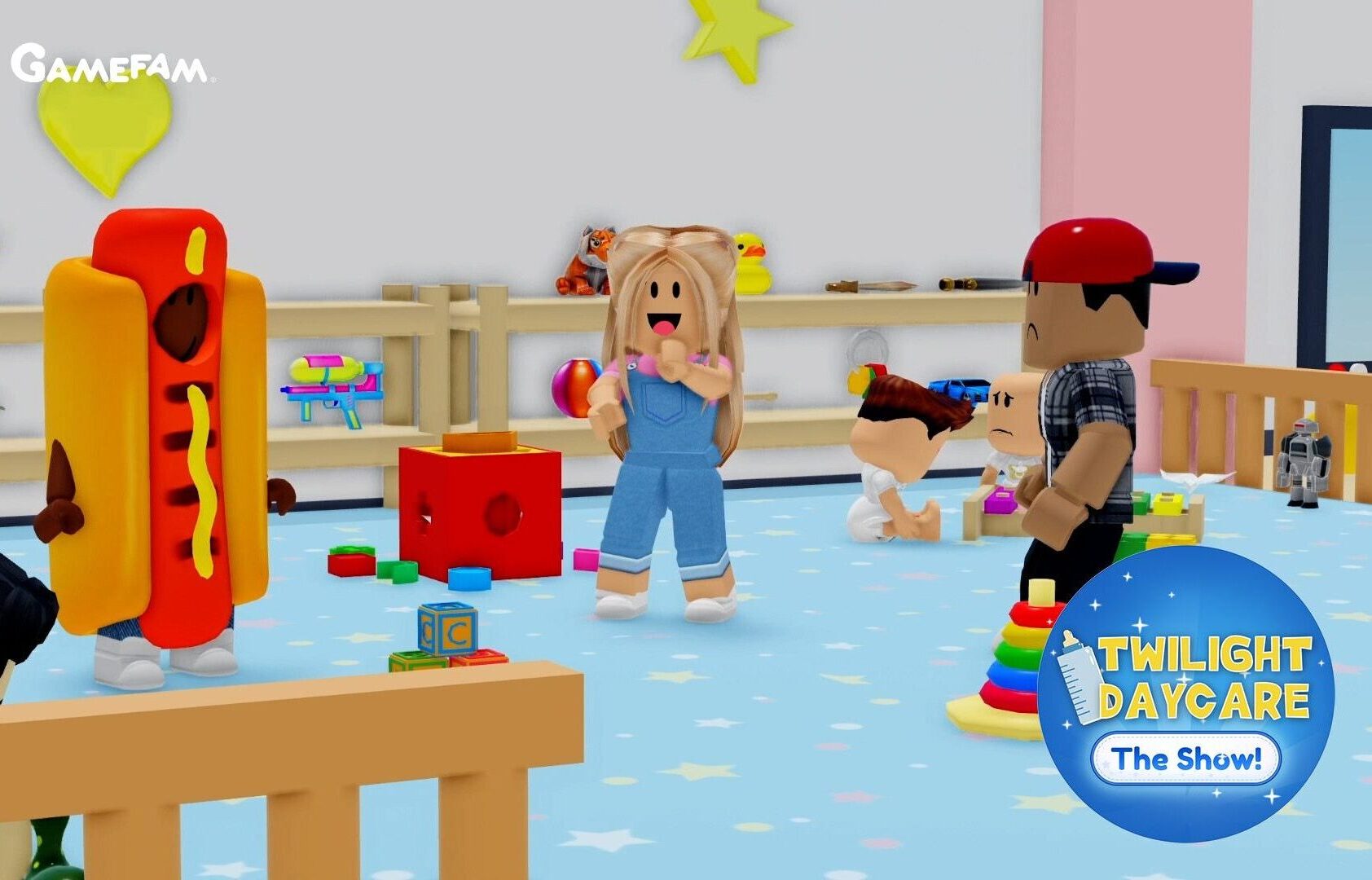 Promotional image for "Twilight Daycare: The Show!" by Gamefam, featuring Roblox-style blocky characters in a colorful nursery setting. A character in a hot dog costume stands on the left, while a blonde character in denim overalls stands in the middle of the room near toy blocks and a shape-sorter cube. On the right, a character in a red cap and plaid shirt looks down at two smaller child characters near a stacking ring toy and wooden crib. Shelves lined with toys, a plush animal, and a rubber duck decorate the background, with the show's logo displayed as a badge in the bottom right corner.
